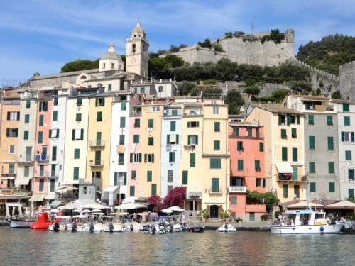 A settlement has existed here for 2,000 years; the 12th century castle is still visible on the hill. At the waterfront, the tightly-packed row of houses was the town's first line of defence against invaders.