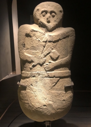 This bloke looks like he might be catching a quick nap while on guard duty.