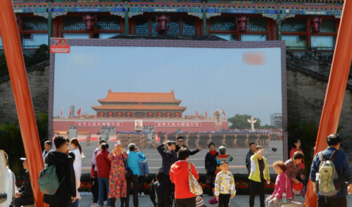 In Beihai Park, big screens replayed non-stop highlights of the massive October 1 parade 
