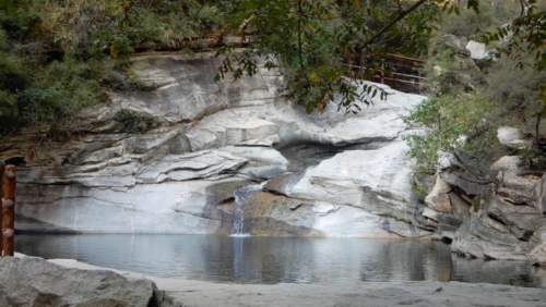 The trail along the valley passes a series of ponds and waterfalls