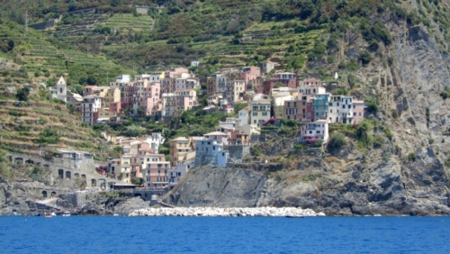 This is Manarola; the Cinque Terre villages are famous for their colourful houses surrounded by steep, vine-covered slopes and tiny, sheltered harbours
