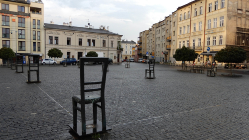 Heroes Square was the place from which many Jews were transported to Auschwitz; the people had been told only that they were being relocated so they brought with them all they could carry - the chairs in the square represent the furniture and other items left behind as people were herded onto trains and transported to the camps