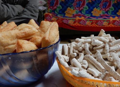 Home-made donuts and dried milk curd - the curd is an important food source in winter