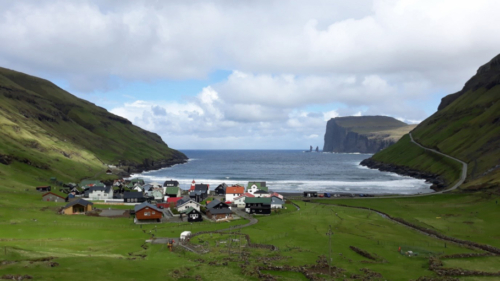 This is Tjørnuvík in the far north, set in a natural amphitheatre below the surrounding mountains; we followed a sign to 'waffles and coffee' and ended up enjoying both at a local man's kitchen table