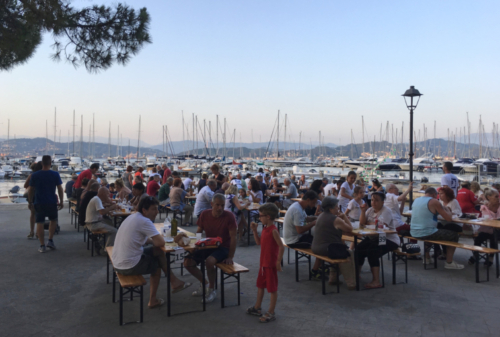 Tables and benches are set up along the waterfront and, for just a few euros, you can enjoy plates of sensational local seafood cooked by villagers and served by teams of young and old alike