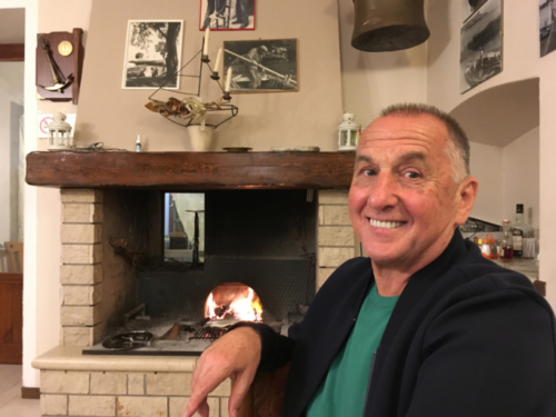 Fish, fresh from Lake Garda, cooking over hot coals in the home/restaurant of a fourth-generation fishing family